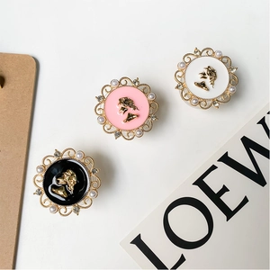 Detailed close-up of retro phone sockets with pearl and rhinestone-encrusted edges