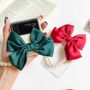 Samsung Galaxy Z Flip case with large satin bow and pearl bracelet handle decoration