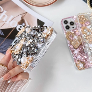 Macro detail of luxury handcrafted rhinestone and pearl floral iPhone case decorations