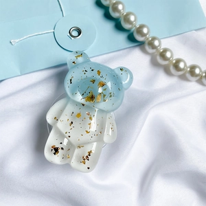 Cute bear phone grip with gold foil sequins and dual-tone blue and white design