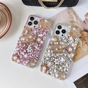 Detailed macro view of luxury rhinestone phone cases with 3D crown and pearl accents