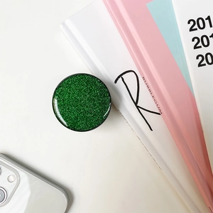 Macro view of green glitter phone socket grip with sparkling textured finish