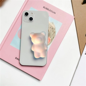 Macro view of a matte translucent bear phone grip with aurora gradient effect
