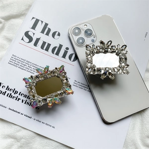 Macro detail of luxury rhinestone square phone socket with mirror and crystal frame