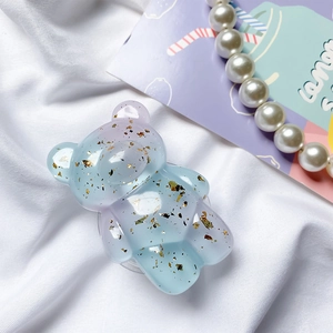 Blue-purple gradient bear phone grip with gold foil sequins on white fabric
