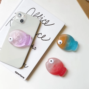 Macro detail of 3D cute fish phone socket with matte gradient finish and pop-out design