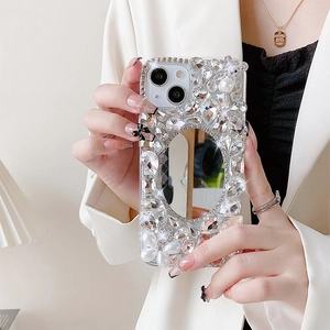 Detailed view of iPhone case featuring a makeup mirror with rhinestones and pearls