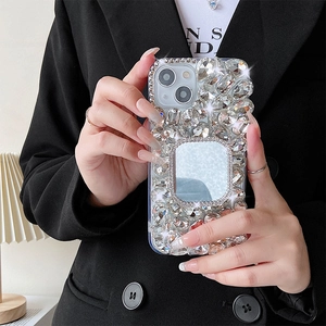 Close-up of luxury iPhone case with handset rhinestones and a square makeup mirror
