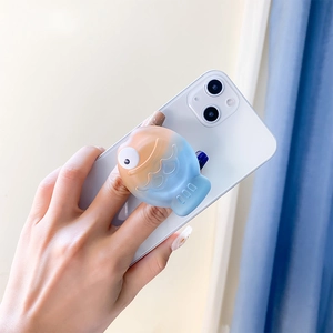 Detailed view of creative 3D fish phone grip with orange and blue gradient scales