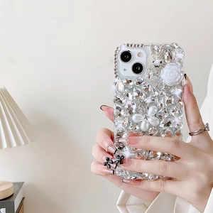 Detailed view of luxury iPhone case with 3D crystal rabbit and pearl rose bow decoration