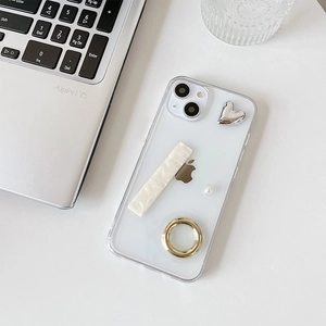 Detail of transparent iPhone case with silver heart charms and a functional ring stand