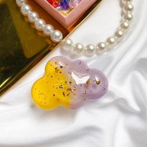 Cloud shape phone grip with gold foil in yellow and purple gradient resin finish
