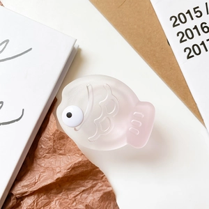 Detail view of the 3D fish phone socket with matte pink gradient texture and big eyes