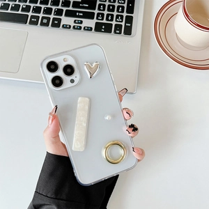 Elegant iPhone case featuring 3D silver heart, pearl inlay, and gold ring kickstand