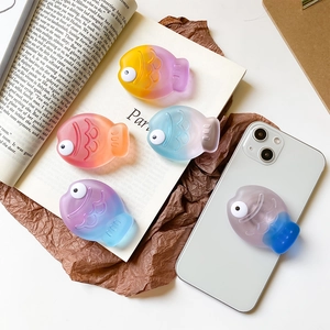 3D fish-shaped expanding cell phone grip stand with vibrant gradient colors