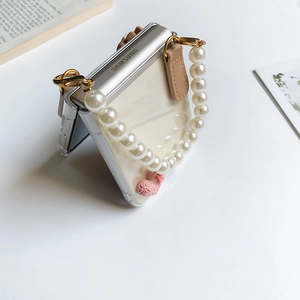 Detail of transparent Z Flip3 case with white pearl handle chain and pink heart charm