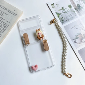 Detail of Z Flip 3 clear case with cute doll, brown strap, and pearl bracelet strap