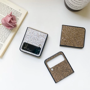 Macro shot of silver sequined protective case for Samsung Galaxy Z Flip phone