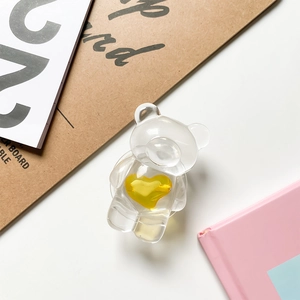 Transparente Bären-Handyhalterung mit gelbem Herz-Detail und Pop-up-Ständer