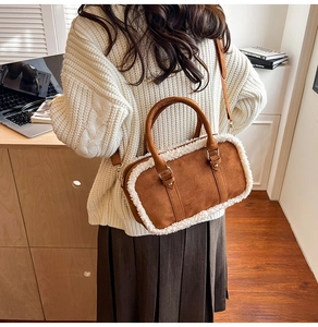 Brown suede shoulder bag with faux shearling trim shown in a cozy lifestyle setting