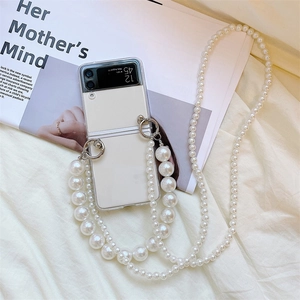 Detail of Galaxy Z Flip case featuring elegant pearl crossbody strap and short hand chain