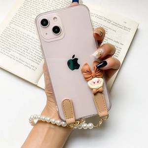 Coque iPhone transparente avec nœud marron, dragonne perles et breloque mignonne