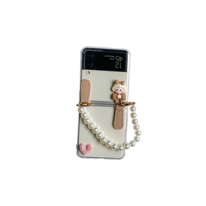 Cute Samsung Galaxy Z Flip 3 case with pearl wrist strap, cartoon girl and pink heart deco