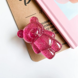 Supporto per telefono a orsetto rosa glitterato con finitura in resina lucida