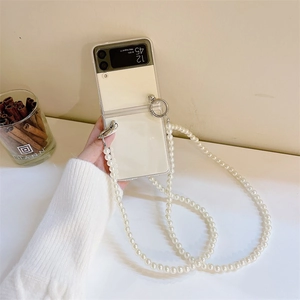 Close-up of clear phone case with white pearl crossbody strap for Galaxy Z Flip series