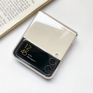 Detailed close-up of ultra-thin clear protective case on a beige folding phone