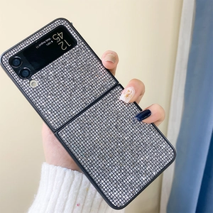 Close-up of luxury Samsung Galaxy Z Flip phone case with shimmering silver rhinestones