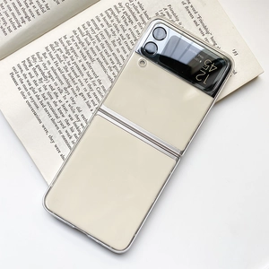 Detail view of ultra-thin beige folding phone case for Samsung Z Flip on a book