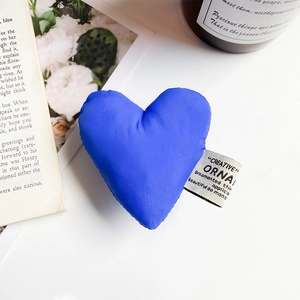 Detailed view of a royal blue heart fabric phone grip with an aesthetic label