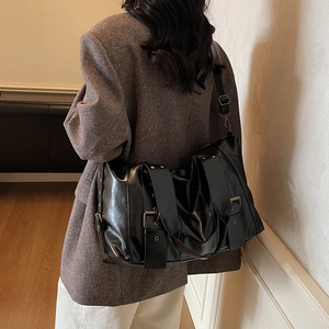 Retro black leather tote bag with metallic studs and adjustable straps for women