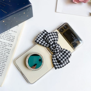 Samsung Galaxy Z Flip case detail with houndstooth bow and rhinestone mirror ring stand