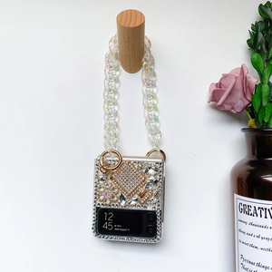 Detail of luxury rhinestones and perfume bottle decoration on Z Flip phone case