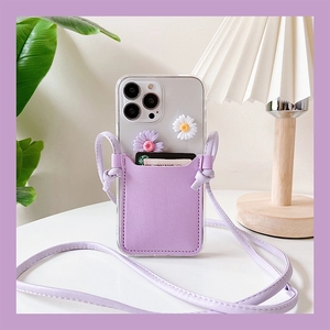 Detailed view of lavender leather crossbody iPhone case with daisy floral ornaments