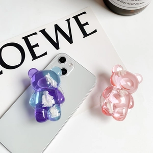 Detail of 3D bear cell phone grip with pink and purple gradient cloud accents