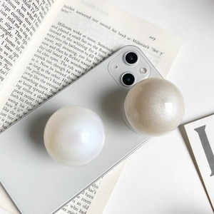 Minimalist pearl crystal ball phone socket grip in iridescent white and champagne gold