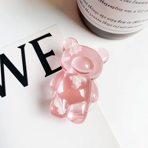 Detailed view of pink translucent bear phone socket with inner cloud textures and glossy resin