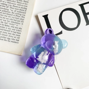 Detail of pink and blue gradient bear phone grip with white cloud-like filling