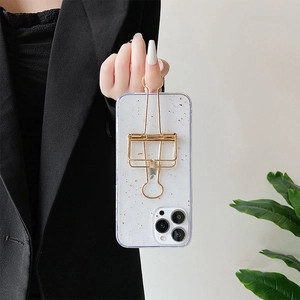 Silver foil glitter phone case for iPhone 16 Pro Max with a gold metal clip ring stand