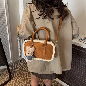 Brown suede Boston bag with faux shearling trim and cute teddy bear charm for women