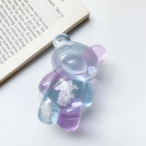 Detailed macro view of a 3D gradient resin bear phone stand with cloud patterns