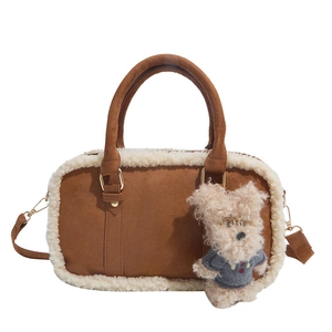 Brown suede crossbody bag with off-white fleece trim and cute teddy bear charm