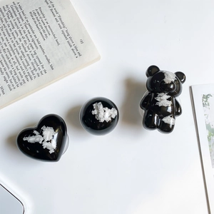 Artistic black bear and heart shaped phone sockets with white textured relief design