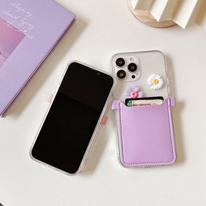 Close-up of iPhone clear case with purple leather card slot and daisy floral decor