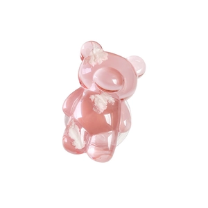 Pink translucent bear-shaped cell phone grip with marble pattern on white background
