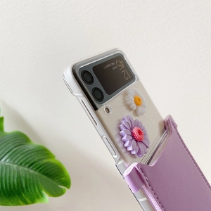 Detail of Galaxy Z Flip case with 3D daisy flowers and purple leather crossbody pouch