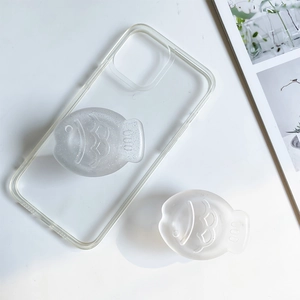 Detail of transparent phone case with two frosted fish-shaped expanding grip stands